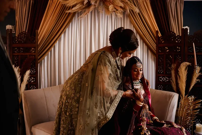 An emotional and tender candid wedding moment between mother of the bride and bride before a Sikh wedding in London by wedding photographer ARJ Photography®
