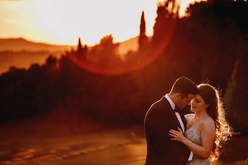 Beautiful sunset portrait of a bride and groom at a destination wedding in Tuscany Italy by wedding photographer ARJ Photography®