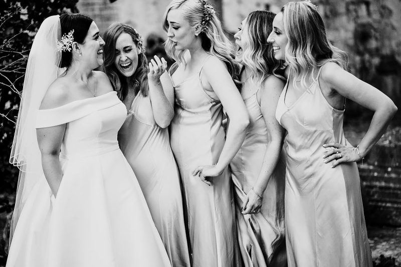 A funny moment between the bride and her bridesmaids at a destination wedding in Hvar Croatia - powerful black and white wedding photography by ARJ Photography®