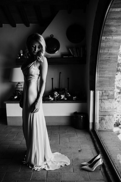 A portrait of the bride just before her wedding ceremony at her destination wedding in Tuscany Italy at Le Filigare - powerful black and white wedding photography by ARJ Photography®
