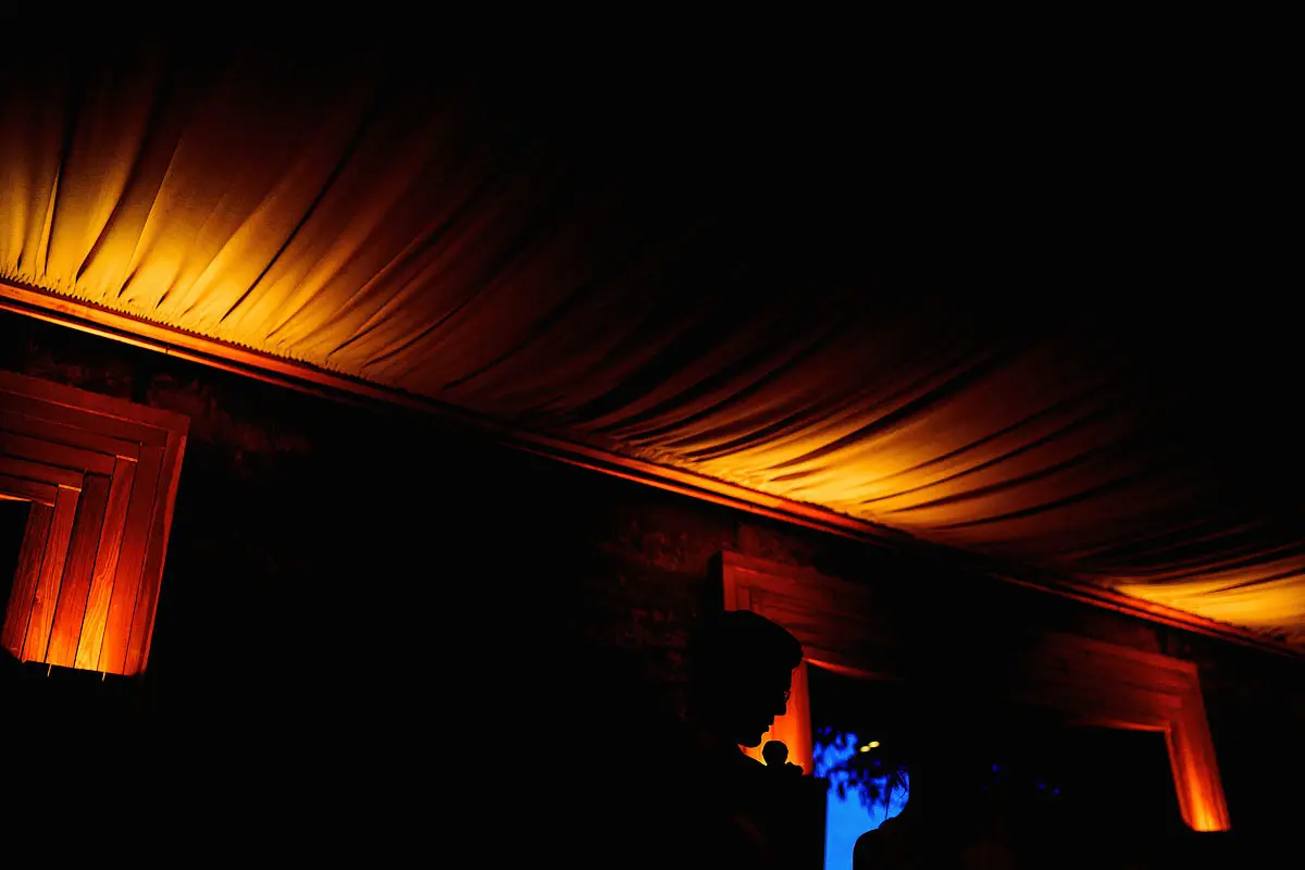 A unique wedding speech photo silhouette of a groom doing his speech in the Cotswolds - artistic wedding photography by ARJ Photography®