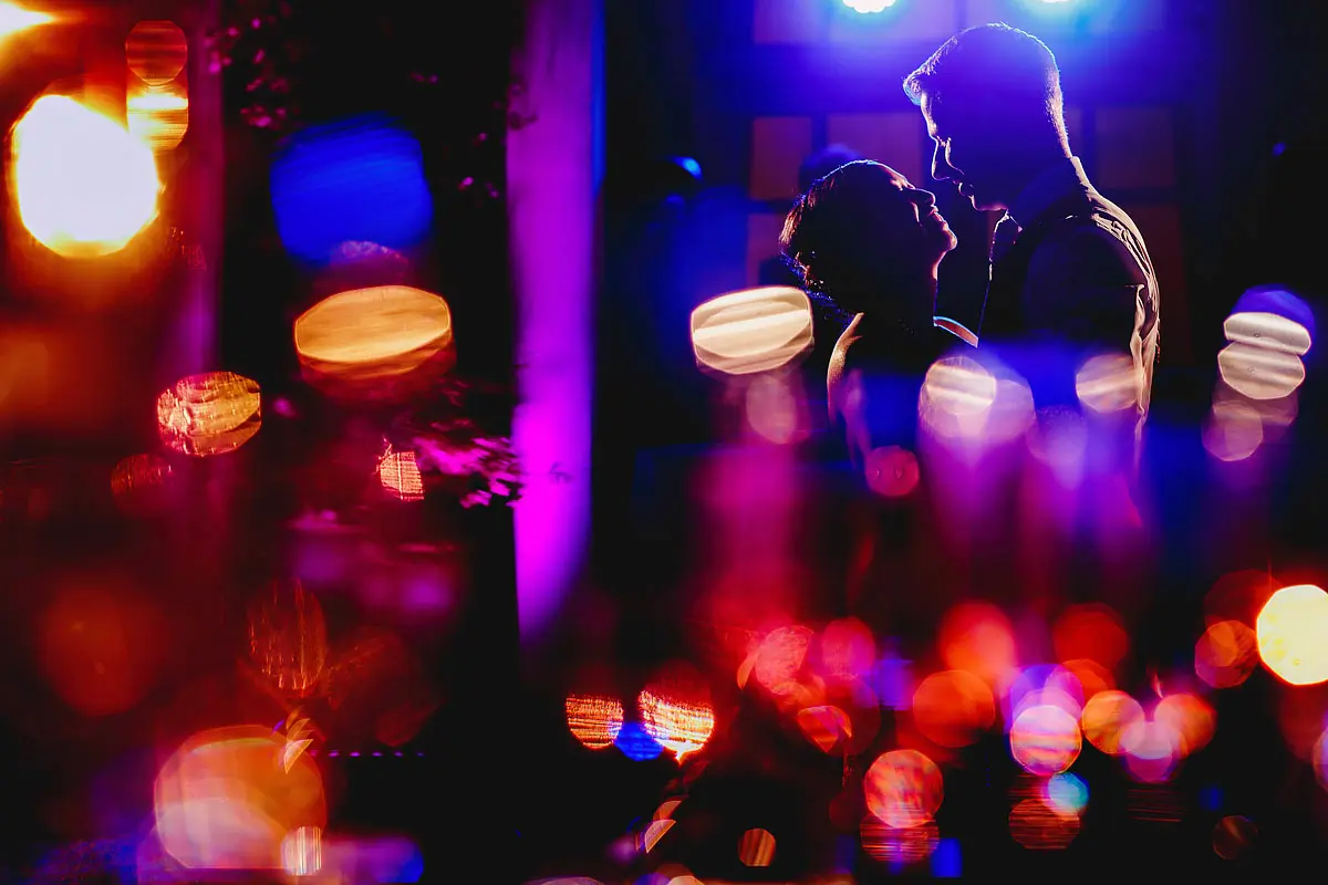 Colourful abstract photo of a bride and groom having their first dance at a destination wedding in Taormina Sicily - artistic wedding photography by ARJ Photography®