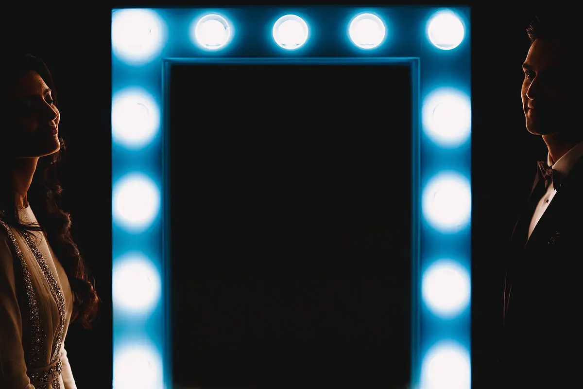 Cool wedding portrait of a bride and groom around a cool mirror at a wedding in Dubai - artistic wedding photography by ARJ Photography®