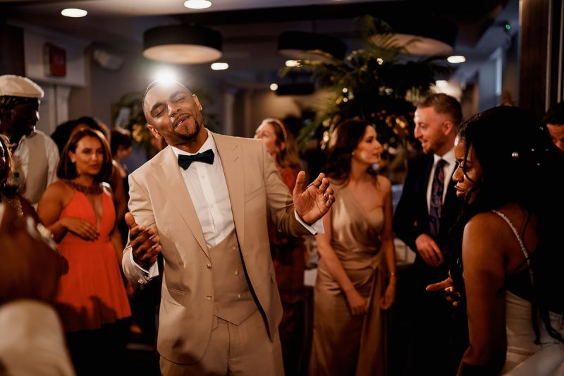 A groom enjoying the music at his wedding in Cheshire - epic wedding party photo by ARJ Photography®