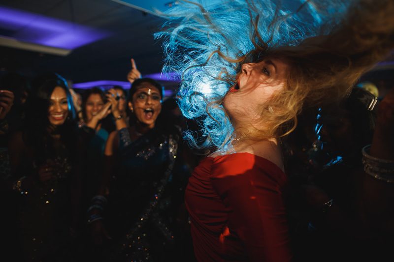 Dance off at a wedding, with an epic hair flick by this wedding guest - epic wedding party photo by ARJ Photography®