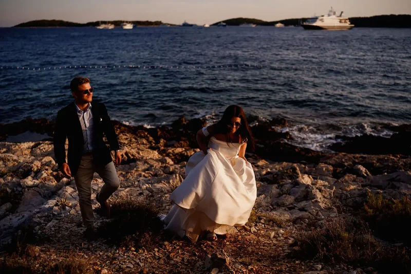Bride and groom by the sea at a destination wedding in Hvar Croatia by destination wedding photographer ARJ Photography®
