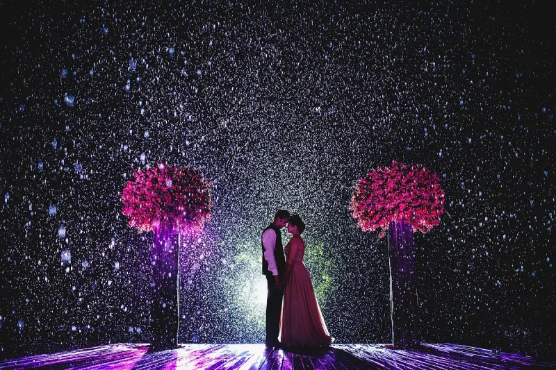 Destination wedding portrait of a bride and groom out in torrential rain in Phuket Thailand by destination wedding photographer ARJ Photography®