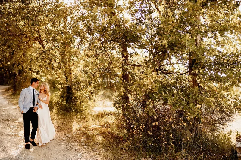 Tuscany destination wedding photo of a bride and groom walking down the track to their wedding venue Le Filigare by destination wedding photographer ARJ Photography®