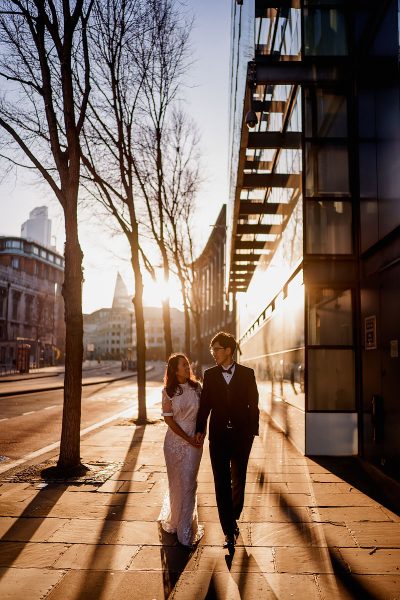 Bride and groom walking the streets of London at sunrise near St Paul's Cathedral - incredible wedding portraits by ARJ Photography®