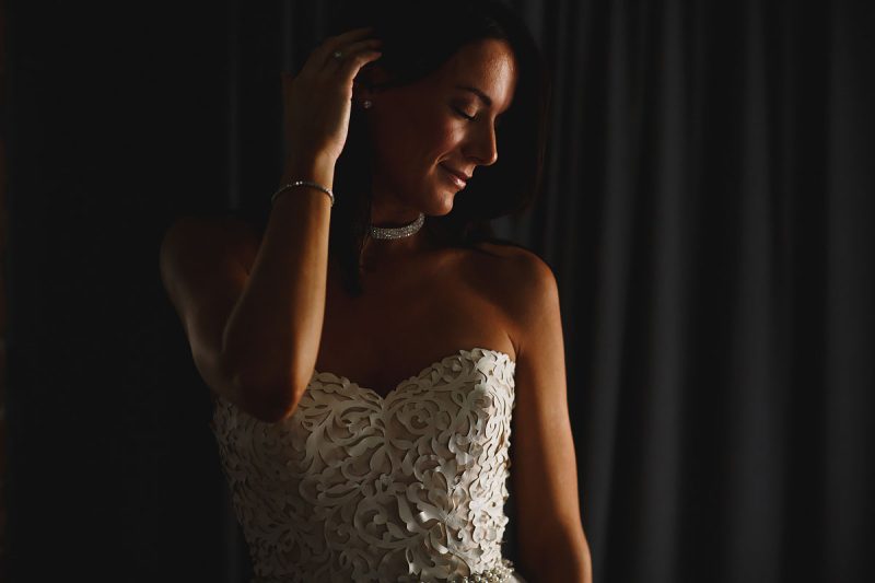 Dramatic beautiful portrait of a bride on the morning of her wedding in a high fashion wedding dress - incredible wedding portraits by ARJ Photography®