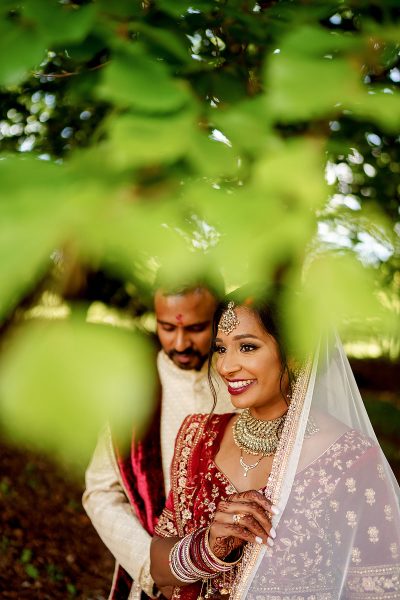 Unique woodland wedding portrait of an Indian bride and groom - incredible wedding portraits by ARJ Photography®