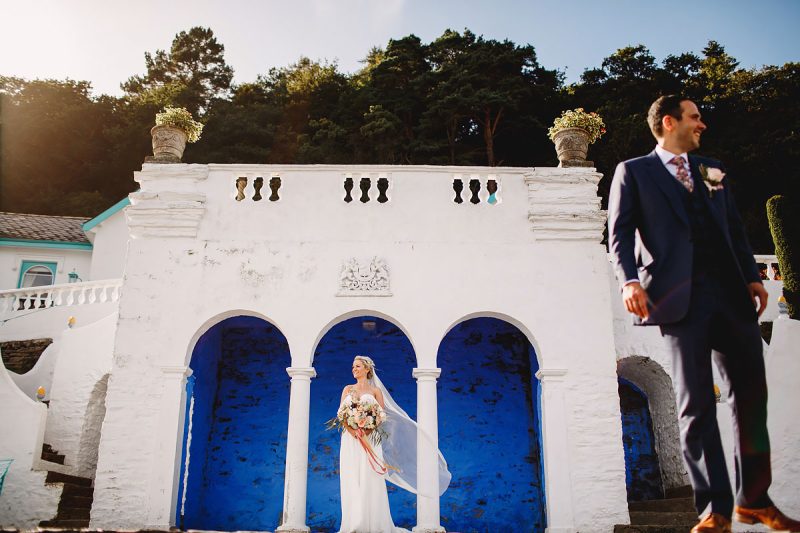 Colourful wedding portrait of a bride and groom at Portmeirion Wales - incredible wedding portraits by ARJ Photography®