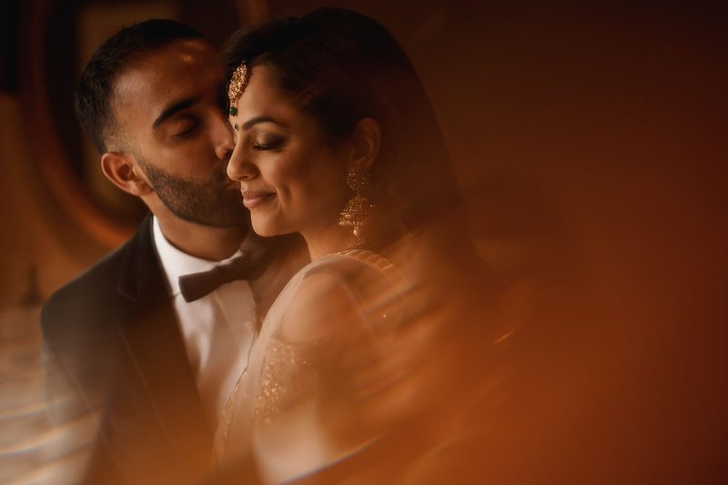 Romantic portrait of an Indian bride and groom before their reception - incredible wedding portraits by ARJ Photography®