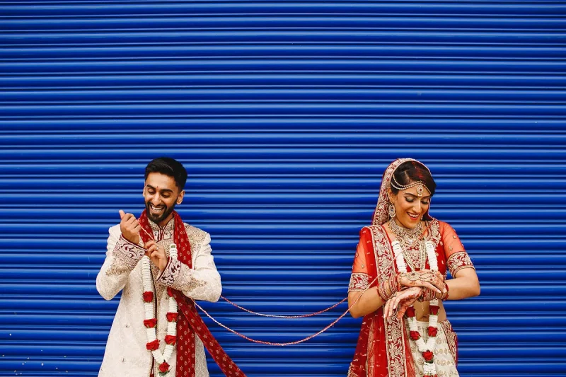 A colourful portrait of a bride and groom after their Hindu wedding - Unique Indian wedding photos by ARJ Photography®