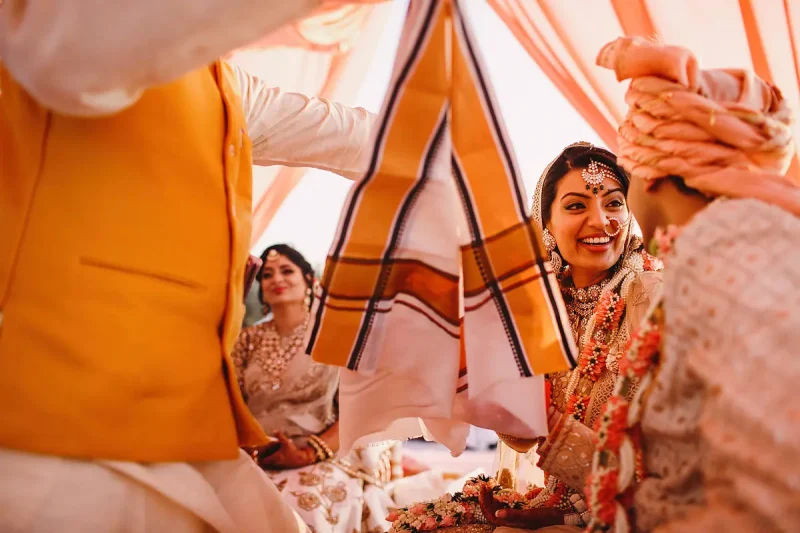 A happy moment between bride and groom during a destination wedding Hindu ceremony - Unique Indian wedding photos by ARJ Photography®