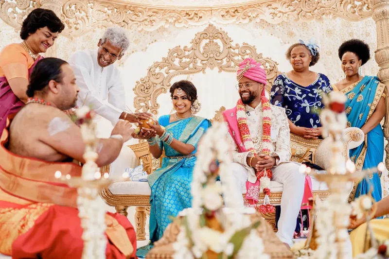 A busy happy moment on the stage during a Tamil Sri Lankan wedding ceremony - Unique Indian wedding photos by ARJ Photography®
