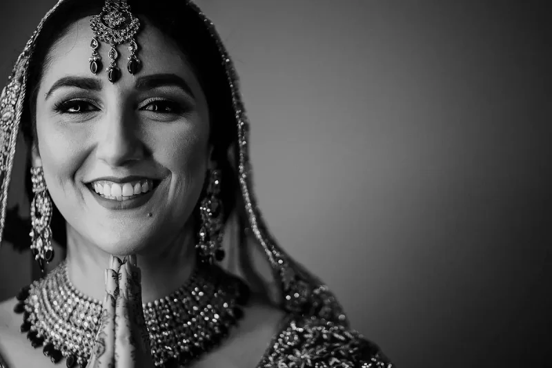 A black and white portrait of a very happy Hindu bride - Unique Indian wedding photos by ARJ Photography®